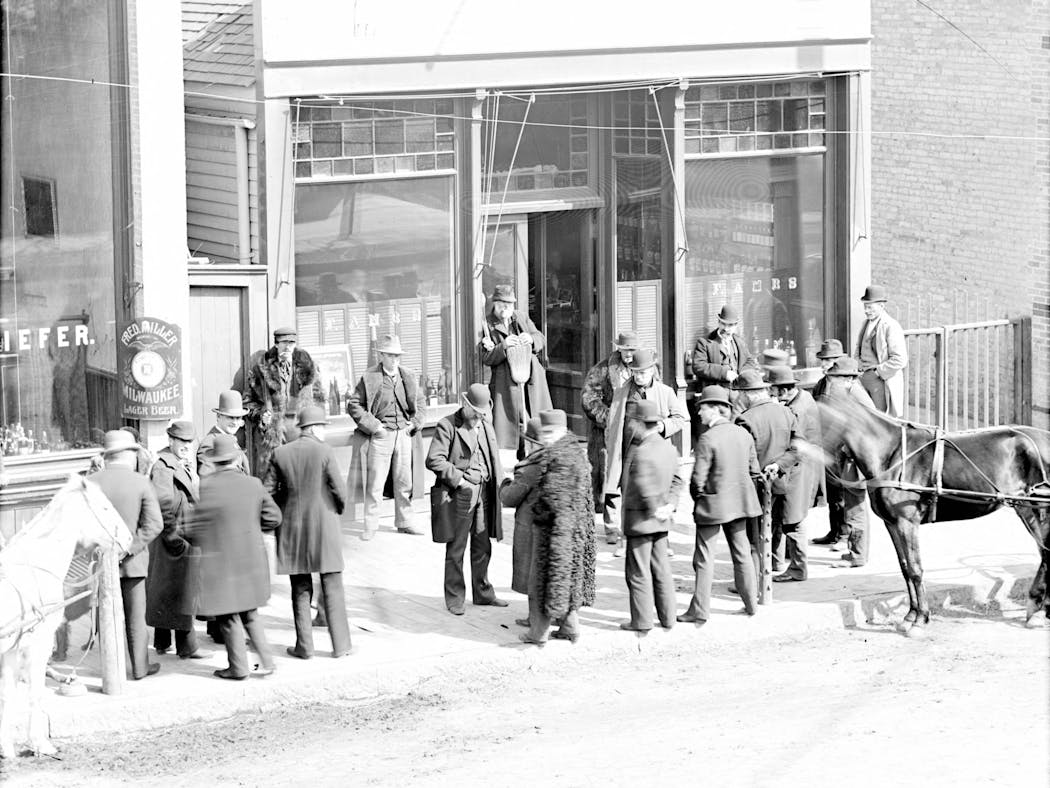 People gathered outside Fred Ambs' Moorhead saloon in the early 1900s.