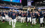 Twins players and staff celebrate after winning the American League Central title. The Minnesota Twins hosted the Los Angeles Angels at Target Field o