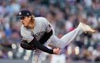 Twins pitcher Joe Ryan worked against the Rockies during the first inning Friday in Denver