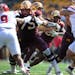 Gophers running back Zach Evans took a handoff from quarterback Athan Kaliakmanis on his way to rushing for 85 yards.