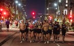 Runners warmed up and decided to run their own race at the start of the 10-mile in Minneapolis on Sunday after the Twin Cities Marathon was canceled.