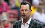 Former Boston Red Sox player Tim Wakefield looks on before the start of a baseball game between the Red Sox and Oakland Athletics at Fenway Park, Wedn