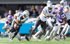Vikings safety Harrison Smith, left, forced a fumble on Panthers quarterback Bryce Young, which D.J. Wonnum (98) recovered and returned 51 yards for a