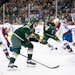 Wild center Marco Rossi (23) got a shot off in the first period while defended by Colorado Avalanche center Joel Kiviranta (94) on Thursday night at X