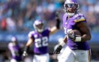 Vikings outside linebacker D.J. Wonnum (98) returns a fumble forced by safety Harrison Smith for a touchdown in the third quarter against the Panthers