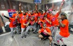 Astros players celebrated in the clubhouse after clinching the AL West title on Sunday in Phoenix.