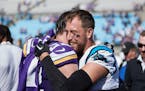 Panthers wide receiver Adam Thielen hugged safety and former teammate Harrison Smith following the Vikings’ 21-13 victory in Charlotte, N.C., on Sun