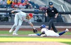 The Mets’ Ronny Mauricio slid under the tag of Phillies third baseman Alec Bohm for a stolen base during the fourth inning Sunday.