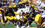 Michigan’s defense swallowed up Rutgers running back Kyle Monangai during the Sept. 23 game in Ann Arbor.