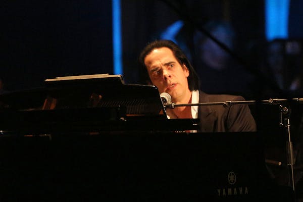Nick Cave, seen here at a 2015 gig in Los Angeles, sat behind the piano for all of Monday’s sold-out concert at the State Theatre in Minneapolis.