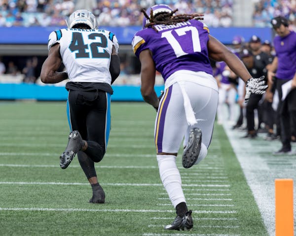 Sam Franklin Jr. (42) of the Carolina Panthers intercepts Minnesota Vikings quarterback Kirk Cousins (8) and returns it for a touchdown in the first q