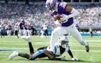 Minnesota Vikings Justin Jefferson (18) catches a 30-yard touchdown pass in the third quarter Sunday, October 1, 2023, at Bank of America Stadium in C