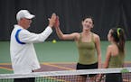 Rochester Mayo’s Claire Loftus, with sister Aoife alongside, accepted congratulations from Blake coach Mike Ach on the doubles state title last seas