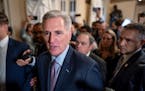 Speaker of the House Kevin McCarthy, R-Calif., was surrounded by press and police on the way to the chamber, at the Capitol in Washington, Tuesday, Oc