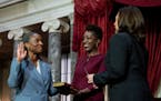 Vice President Kamala Harris, right, swears in Laphonza Butler, D-Calif., left, to the Senate to succeed the late Sen. Dianne Feinstein during a re-en
