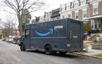An Amazon Prime truck pulls away after a delivery in Washington, D.C.