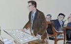 In this courtroom sketch Tuesday from New York, FTX founder Sam Bankman-Fried, second from right, seated at defense table, looked behind as Courtroom 