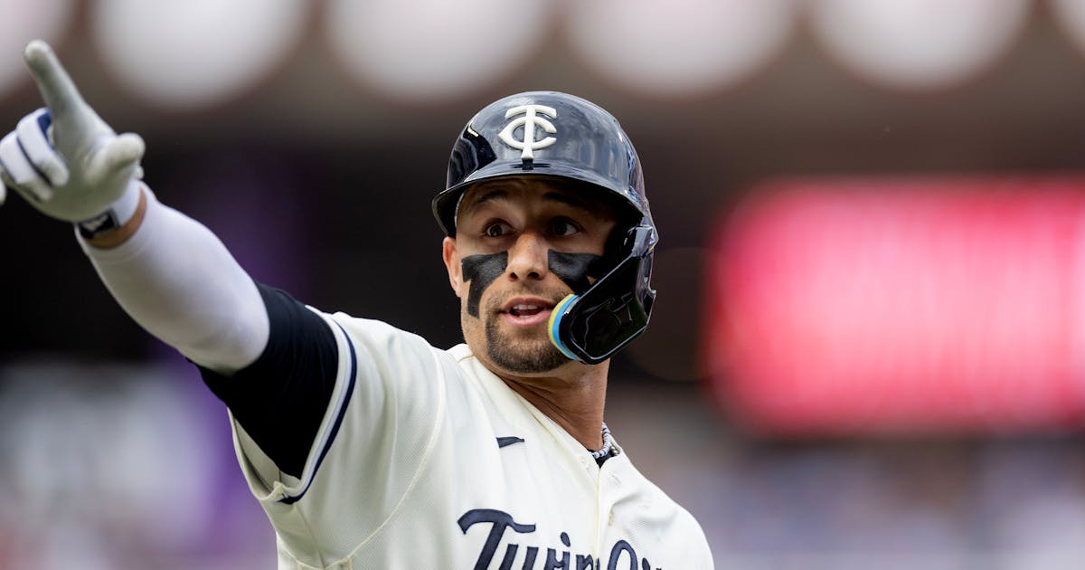 Lewis homered twice, the Twins defeated the Blue Jays to end the losing streak