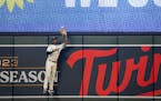 Twins center fielder Michael A. Taylor went to the fence for a leaping catch of a ball hit by Toronto’s Matt Chapman on Tuesday at Target Field.