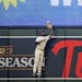 Twins center fielder Michael A. Taylor went to the fence for a leaping catch of a ball hit by Toronto’s Matt Chapman on Tuesday at Target Field.