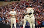 Jhoan Duran approached his teammates as fans went crazy after the Twins defeated the Blue Jays in Game 1 at Target Field.