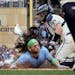 Minnesota Twins catcher Ryan Jeffers tags out Bo Bichette (11) of the Toronto Blue Jays in the fourth inning during Game 1 of the Wild Card series, Tu
