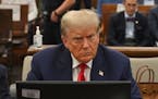 Former President Donald Trump sits during his civil fraud trial at the State Supreme Court building in New York, Wednesday, Oct. 4, 2023. 