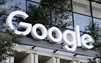 FILE - A Google sign hangs over an entrance to the company’s new building, Sept. 6, 2023, in New York. Google on Wednesday, Oct. 4, unveiled a next-