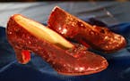A pair of ruby slippers once worn by actress Judy Garland in the “The Wizard of Oz” are displayed at a news conference Tuesday, Sept. 4, 2018, at 