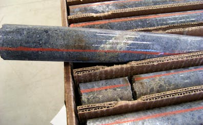 A core sample drilled from underground rock in 2011 in northern Minnesota shows a band of shiny minerals containing copper, nickel and precious metals