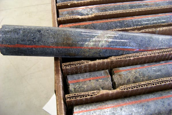 A core sample drilled from underground rock in 2011 in northern Minnesota shows a band of shiny minerals containing copper, nickel and precious metals