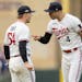 Twins pitcher Sonny Gray, left, and shortstop Carlos Correa celebrate a fifth-inning pickoff play during Game 2 of the AL wild-card series against the