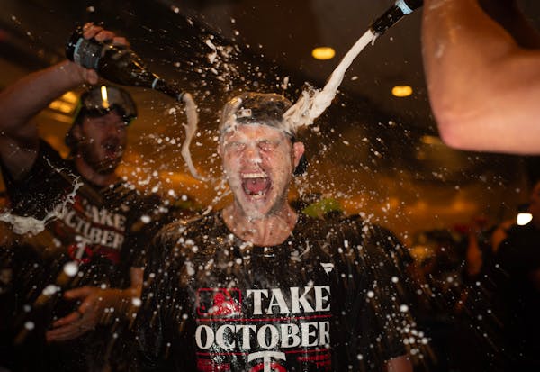 Winning pitcher Sonny Gray was doused with champagne Wednesday after the Twins beat the Blue Jays to sweep their AL wild-card series.