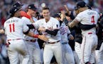 Minnesota Twins players celebrate at the end of the Game 2 of the Wild Card series, Wednesday, October 4, 2023, at Target Field in Minneapolis, Minn. 