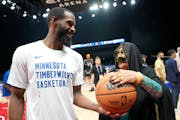 Timberwolves guard Mike Conley visited with an Emirati woman during a practice session in Abu Dhabi this week.