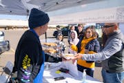 Bobby Yang sold mochi puffs Sunday at a pop-up market outside the old St. Paul Sears building.