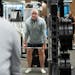 John Moeller, 54, works out with weights at LifeTime Fitness in Eagan. Moeller, a pilot, resolved in July to improve his fitness and diet and has lost