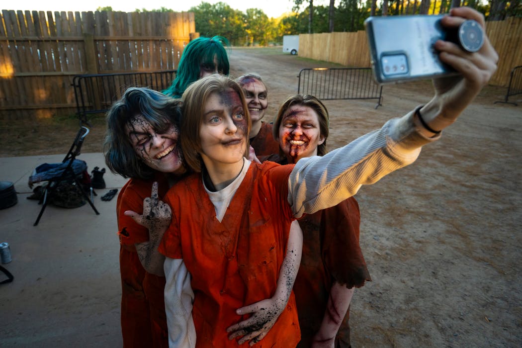 Once they all had their makeup and costumes on, the undead prisoners took a selfie with each other outside the actor barn.
