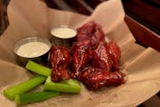 Ranger wings are tossed in a combination of barbecue and Buffalo sauces for a sweet and spicy snack.