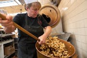 Brenda Lamb, owner of Candyland, mixed a fresh batch of caramel popcorn Oct. 20 in St. Paul. Lamb said her biggest challenge this holiday season is �