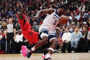 The Timberwolves’ Anthony Edwards, right, battled the Raptors’ Pascal Siakam on Wednesday night. Edwards tied a career high with 14 rebounds in th