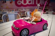 The Dreamsicle Cream Soda is served, seat-belted in, in a convertible car at the Malibu Barbie Cafe pop-up experience at the Mall of America in Bloomi