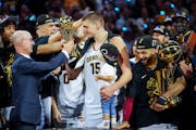 NBA Commissioner Adam Silver handed the Finals MVP award to Denver’s Nikola Jokic after the Nuggets won the championship June 12.