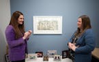 Joanna Lindell, left, and Jenna Reck talked about the etching “Ornamentation” by Minneapolis artist James Boyd Brent that Reck chose for her offic