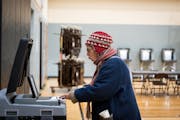 Susan Barksdale inserted her ballot after voting at Martin Luther King Park Recreation Center on Election Day in Ward 8 of Minneapolis on Tuesday.