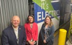 Brian Funk, chief operating officer of Metro Transit, left, with Lesley Kandaras, general manager and Carrie Desmond, manager of electric bus infrastr