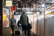 Passengers walk in Concourse D in Terminal 1, which is currently under renovation, at Minneapolis-St. Paul Airport on Thursday, Nov. 9, 2023. ] LEILA 