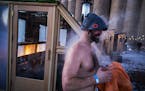 Israel Lowell emerged from a sauna during the Great Northern in February 2023. This season’s Sauna Village, held at Malcolm Yards in Minneapolis, wi