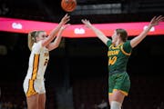 Gophers forward Mallory Heyer shot a three-pointer over North Dakota State guard Abby Krzewinski in the first half of Minnesota’s 75-53 victory Wedn