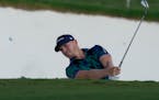 Matt Wallace played a bunker shot on the 18th hole during the third round of the DP World Tour Championship in Dubai, United Arab Emirates, on Saturda